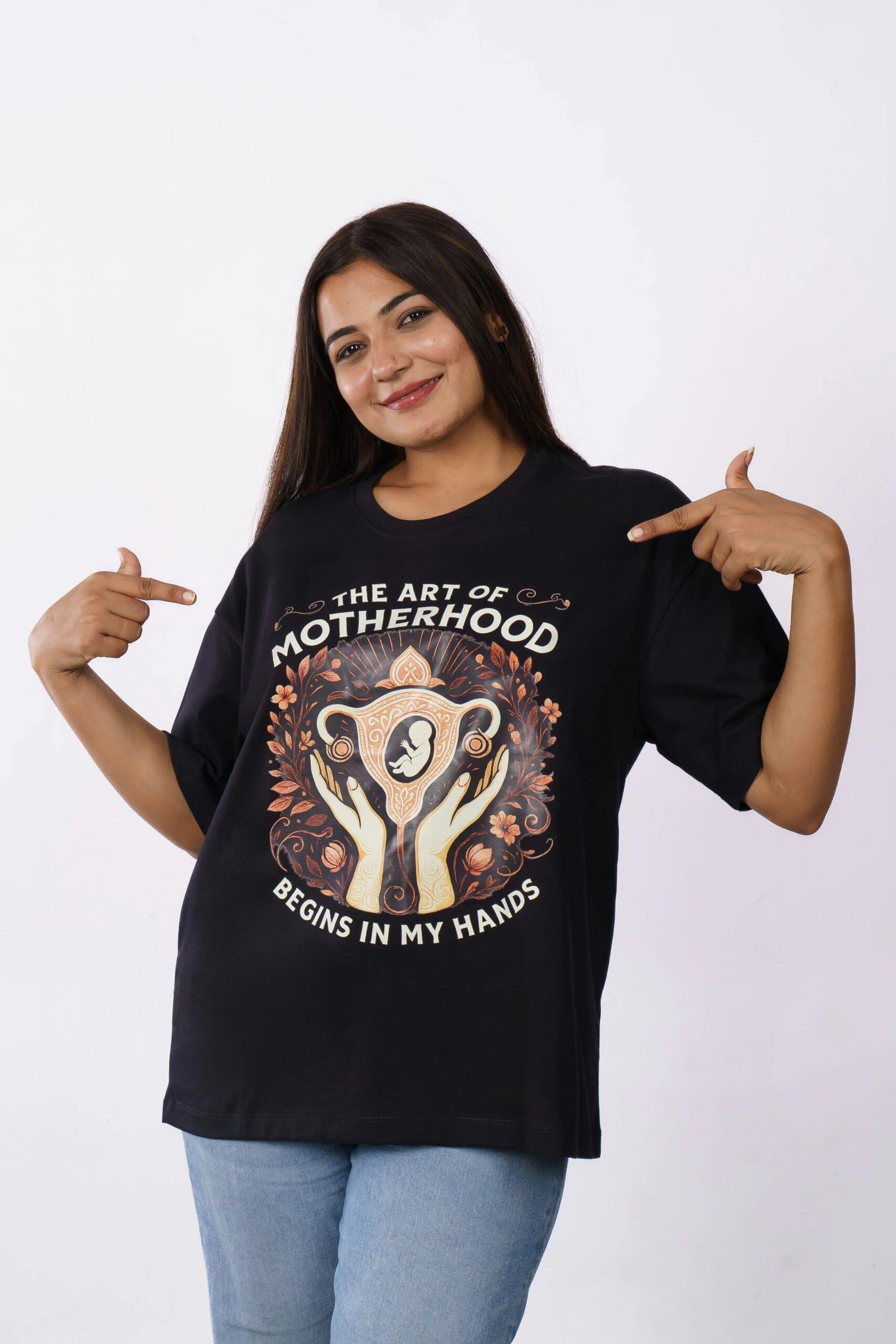 Woman in an oversized t-shirt with an empowering motherhood art design.
